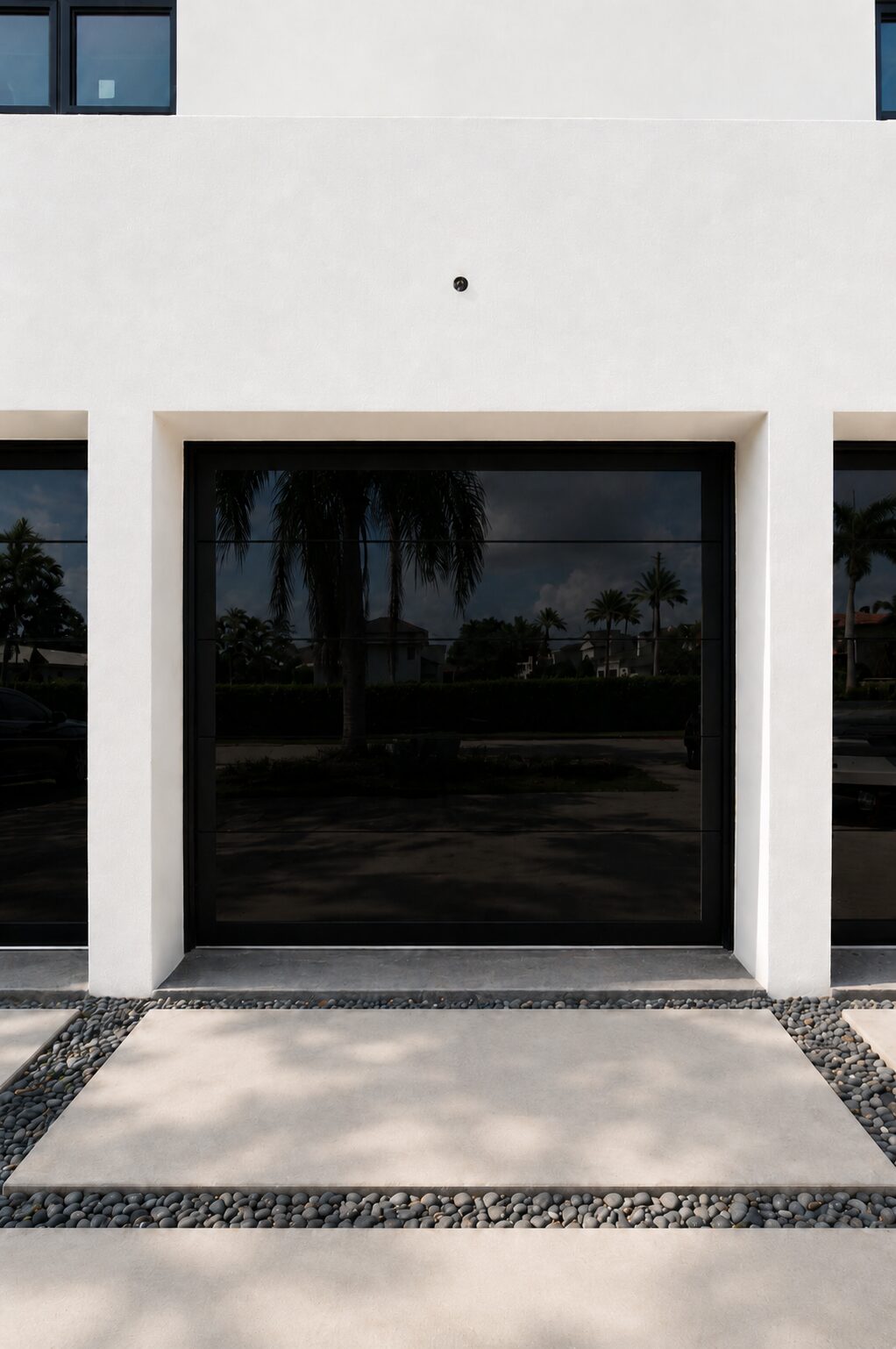 Tall glass garage doors on a modern home
